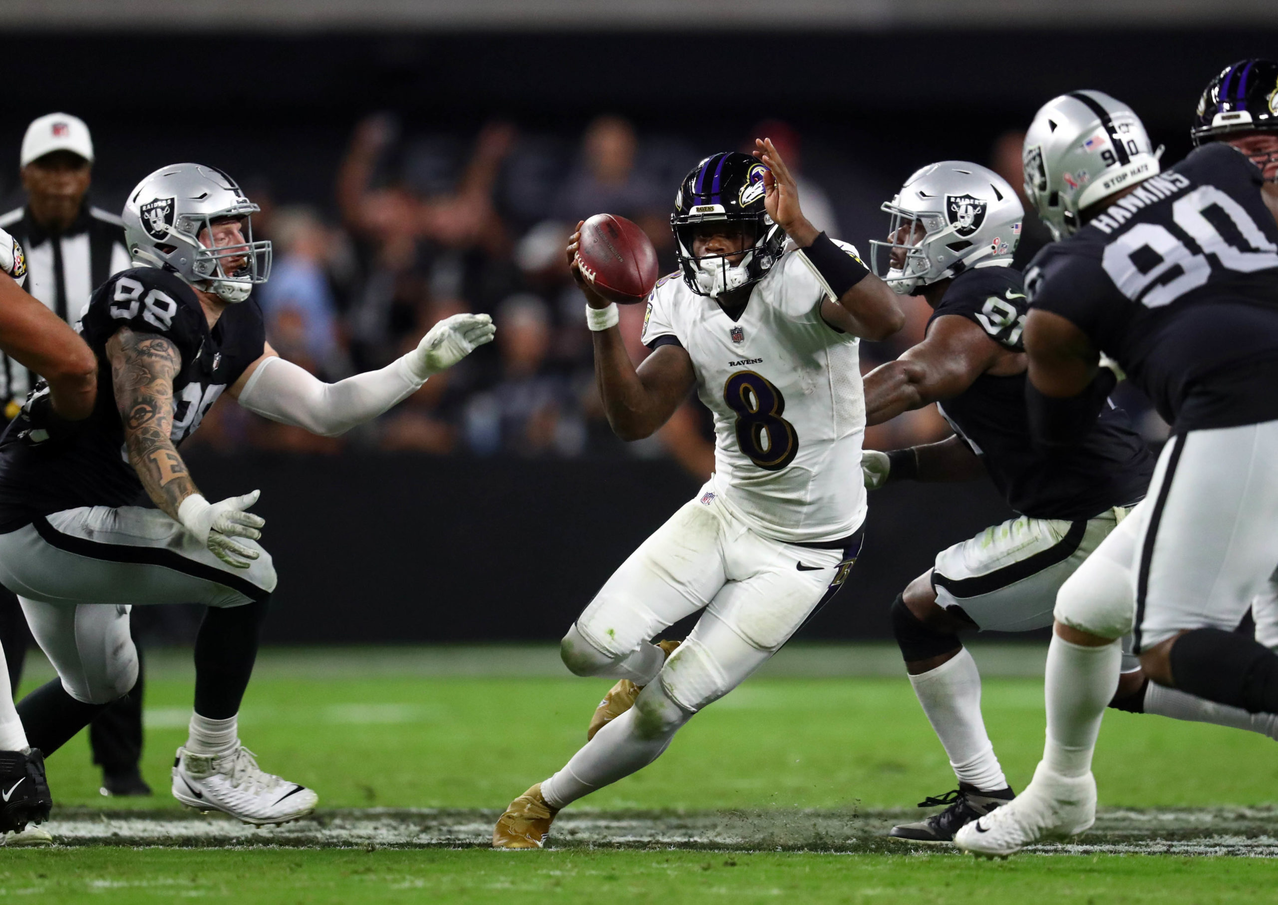 Lamar Jackson runs against Raiders