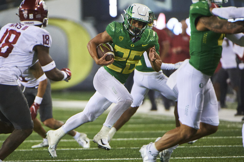 Oregon running back Travis Dye rushing against Washington State