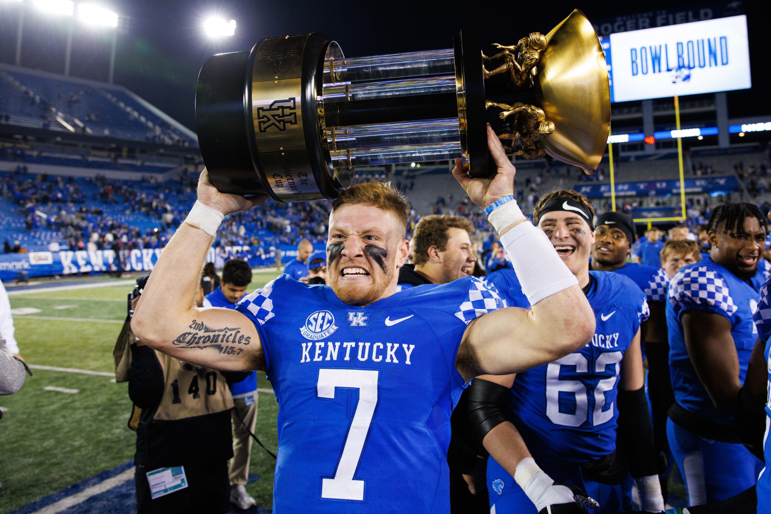 Nov 26, 2022; Lexington, Kentucky, USA; Kentucky Wildcats quarterback Will Levis (7) holds up the Governor’s Cup trophy after winning the game against the Louisville Cardinals at Kroger Field. Mandatory Credit: Jordan Prather-USA TODAY Sports