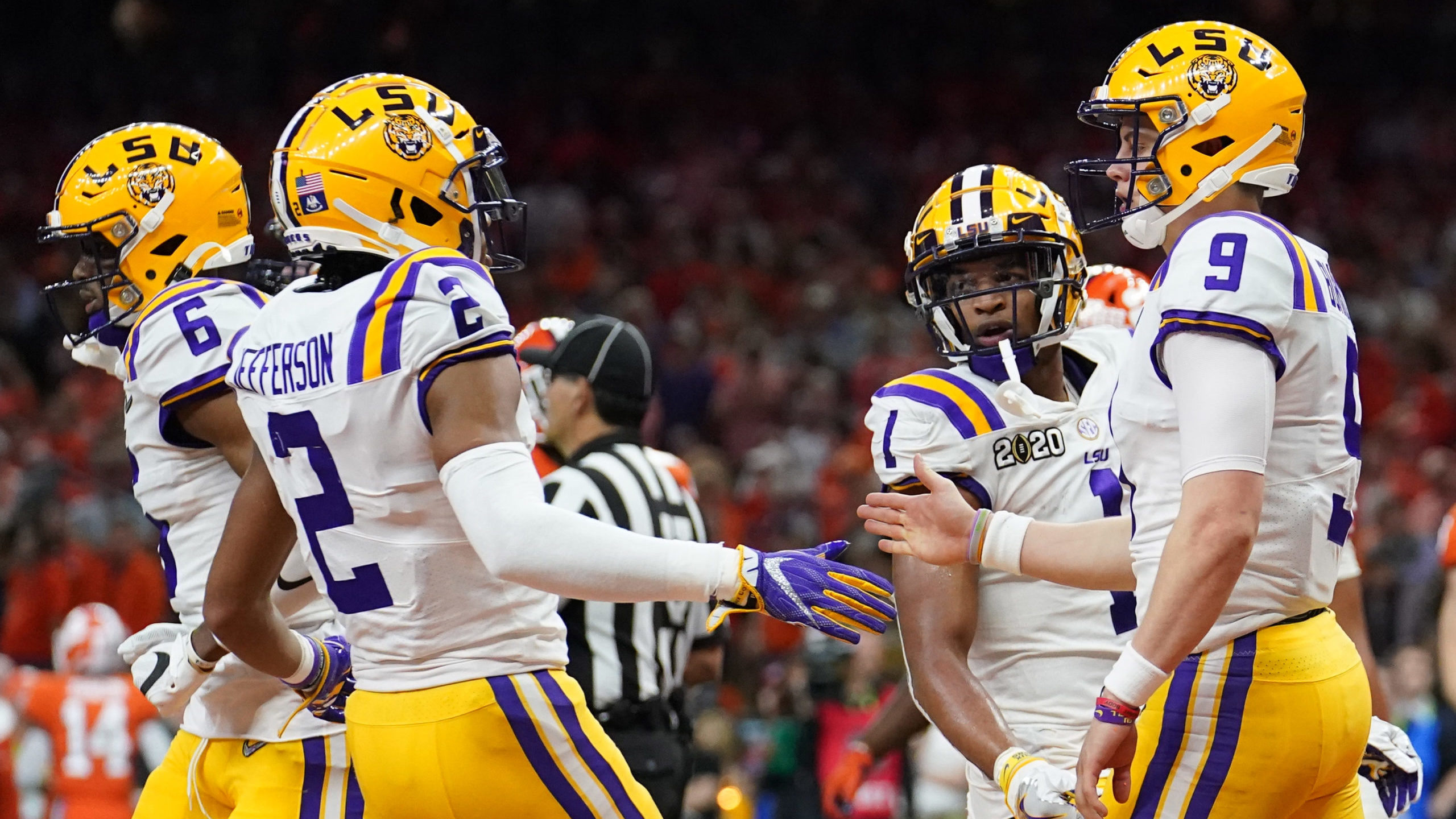 Jan 13, 2020; New Orleans, Louisiana, USA; LSU Tigers quarterback Joe Burrow (9) celebrates with wide receiver Justin Jefferson (2) after scoring a touchdown against the Clemson Tigers second quarter in the College Football Playoff national championship game at Mercedes-Benz Superdome. Mandatory Credit: Kirby Lee-USA TODAY Sports