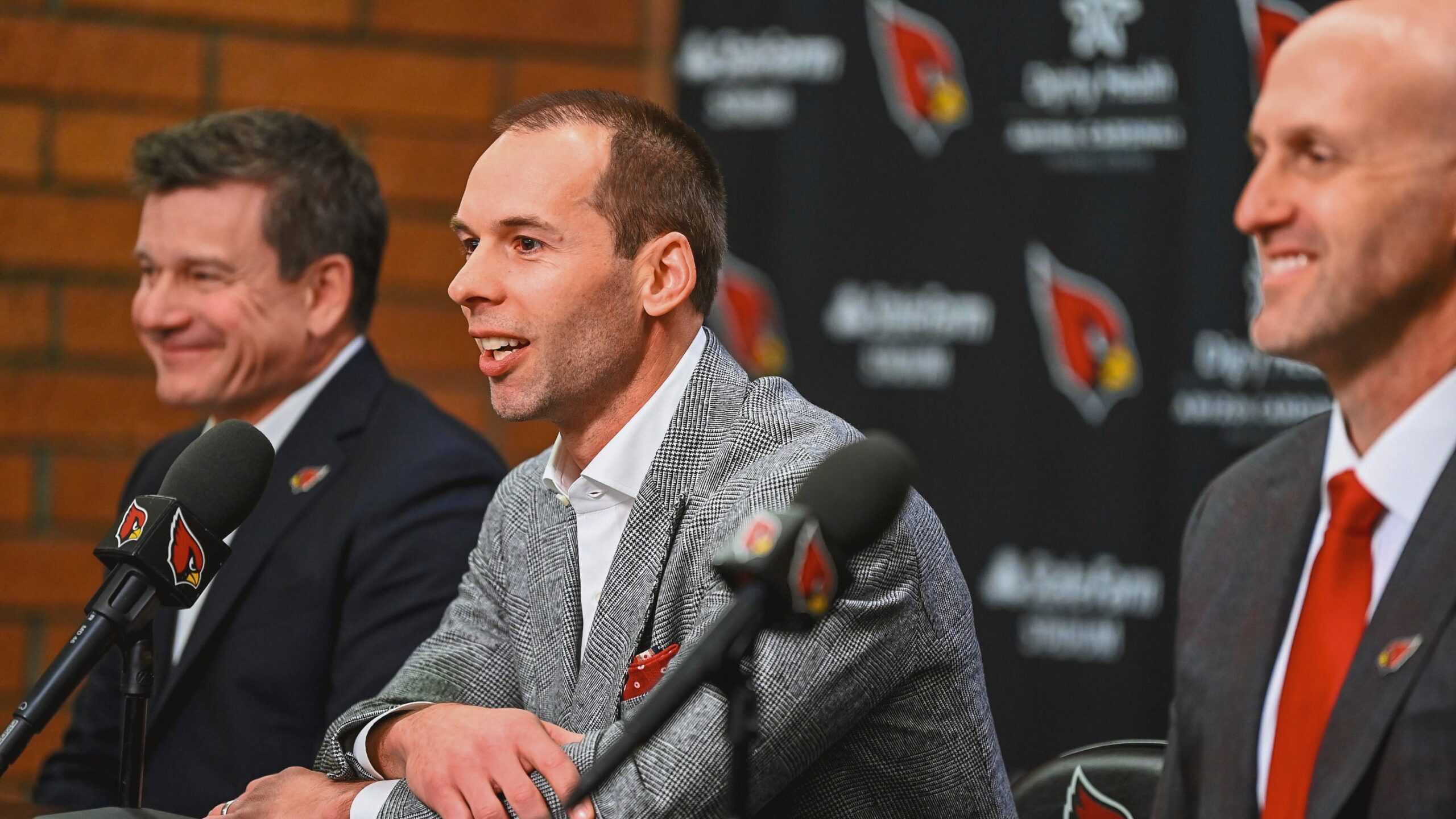 Cardinals coach Jonathan Gannon and general manager Monti Ossenfort prepare for a press conference.