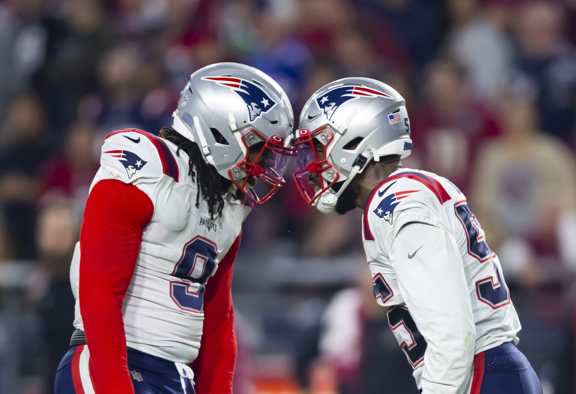 New England Patriots linebackers Matthew Judon and Josh Uche knock helmets