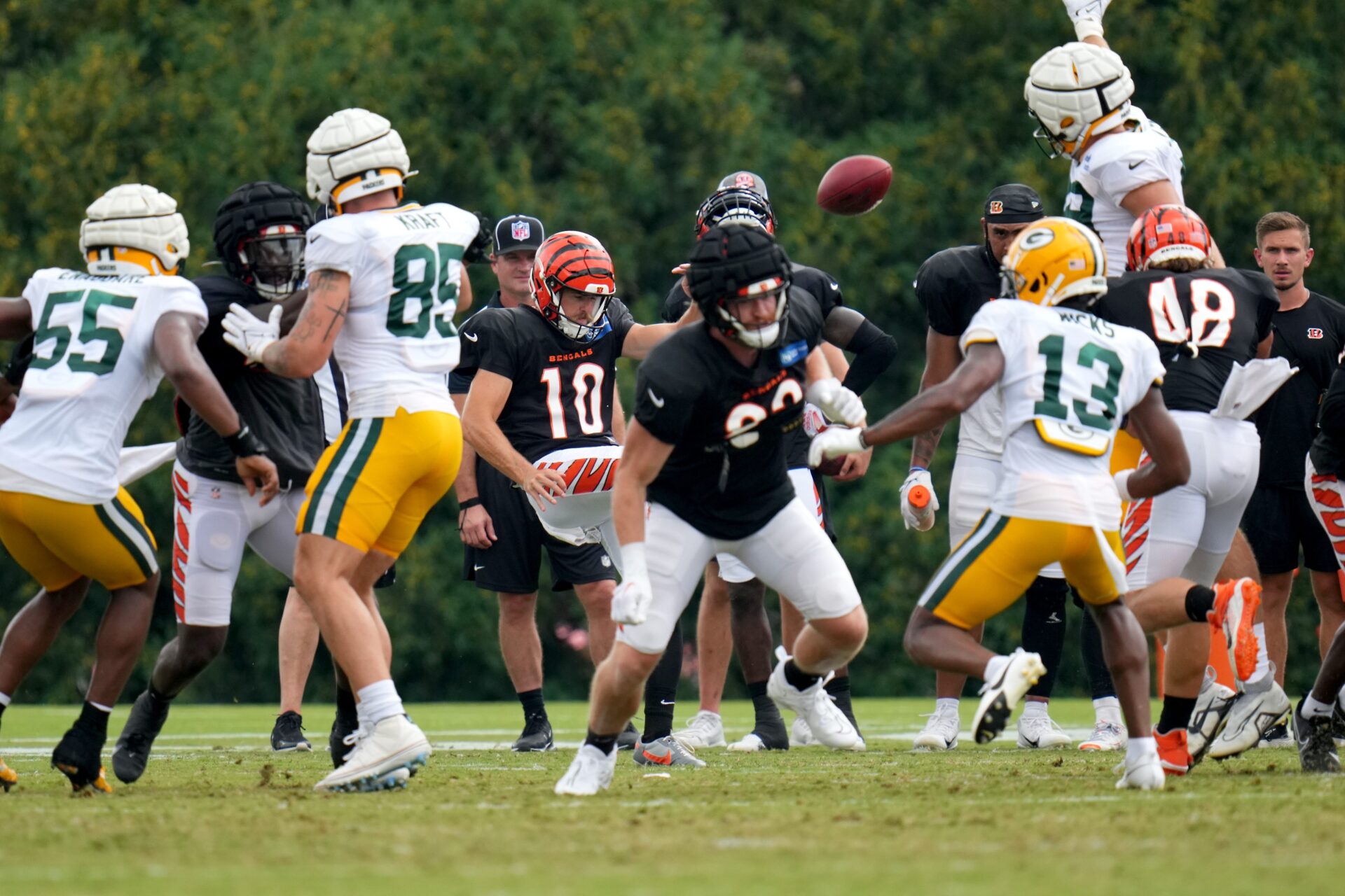 A zoomed-out image showing two teams at the line of scrimmage while a punter gets ready to punt the ball