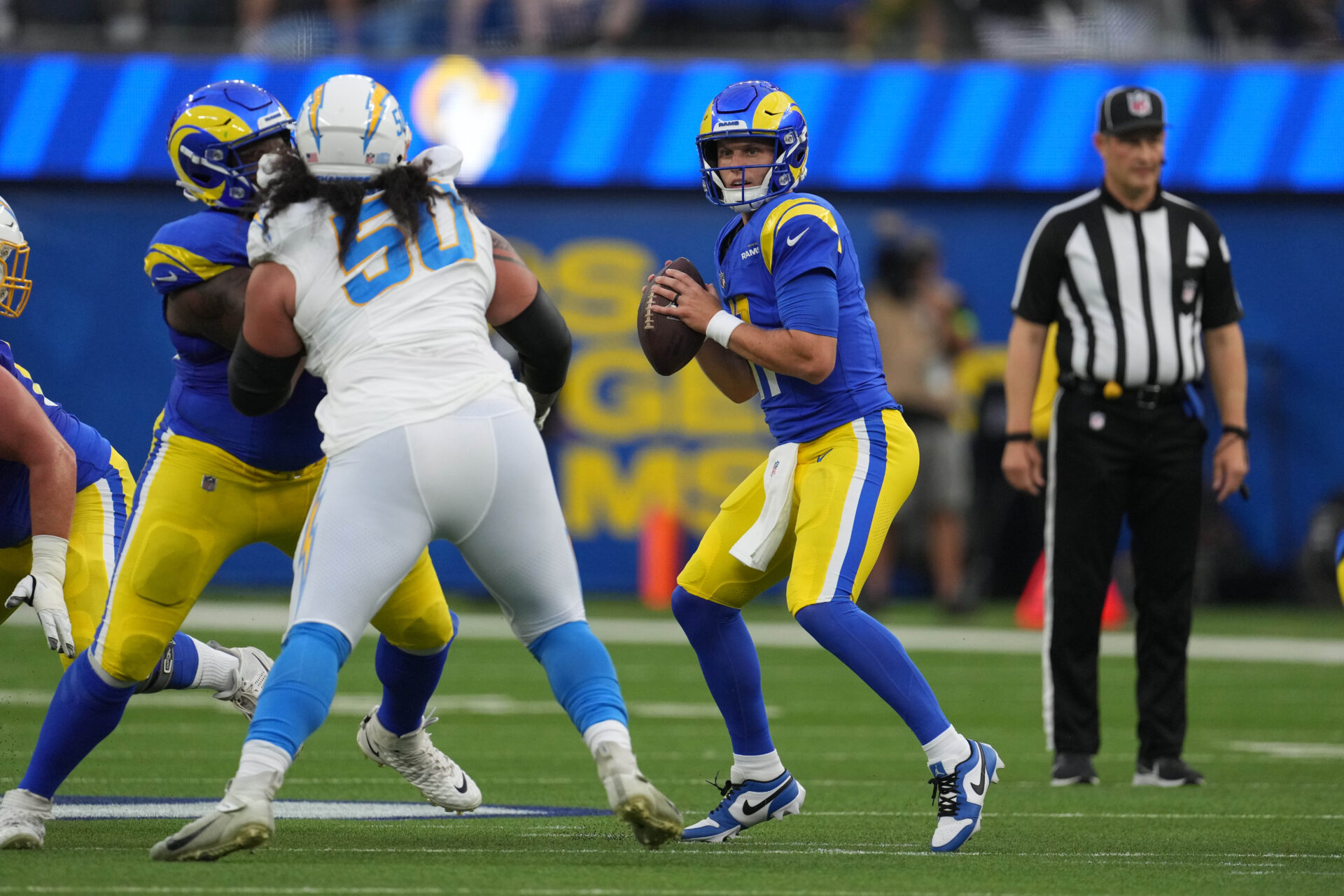 Brett Rypien throws a ball in the pocket