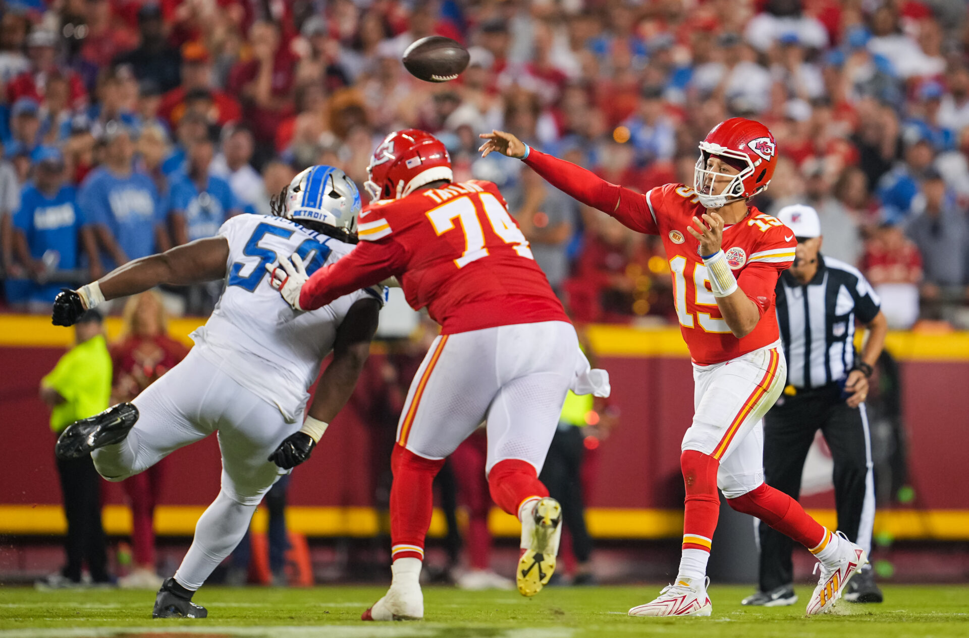 Jawaan Taylor blocks a Detroit Lion who is heading for Patrick Mahomes, who is throwing the ball