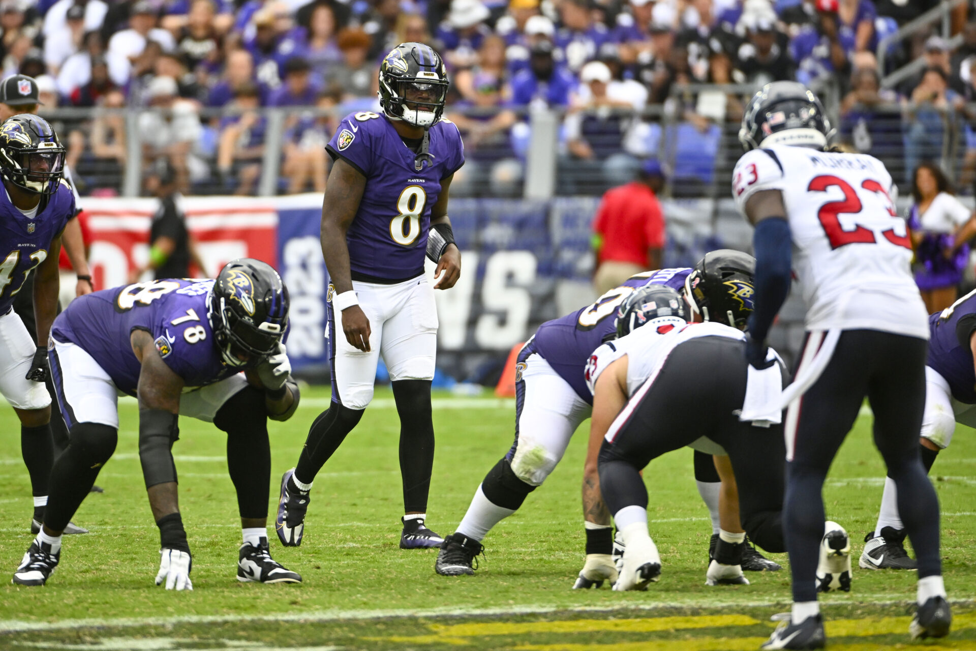 Lamar Jackson stands at the line of scrimmage