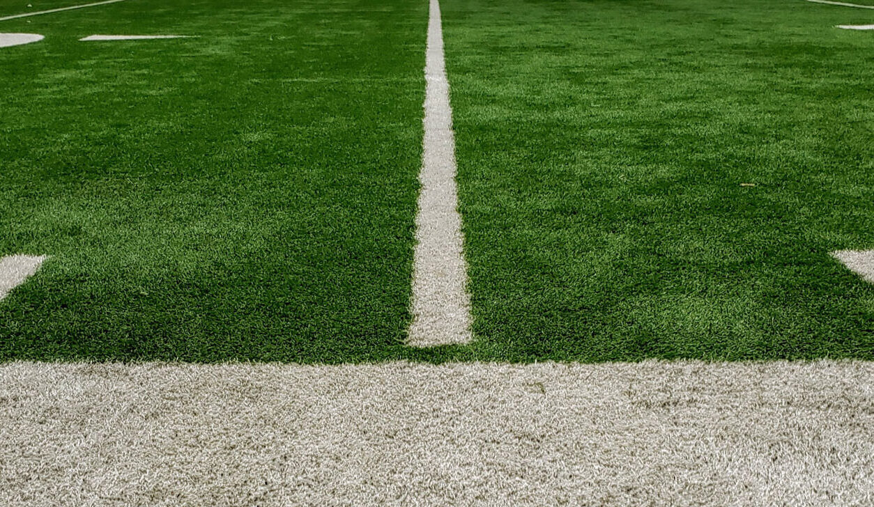 Close up picture of the feild from the sideline.