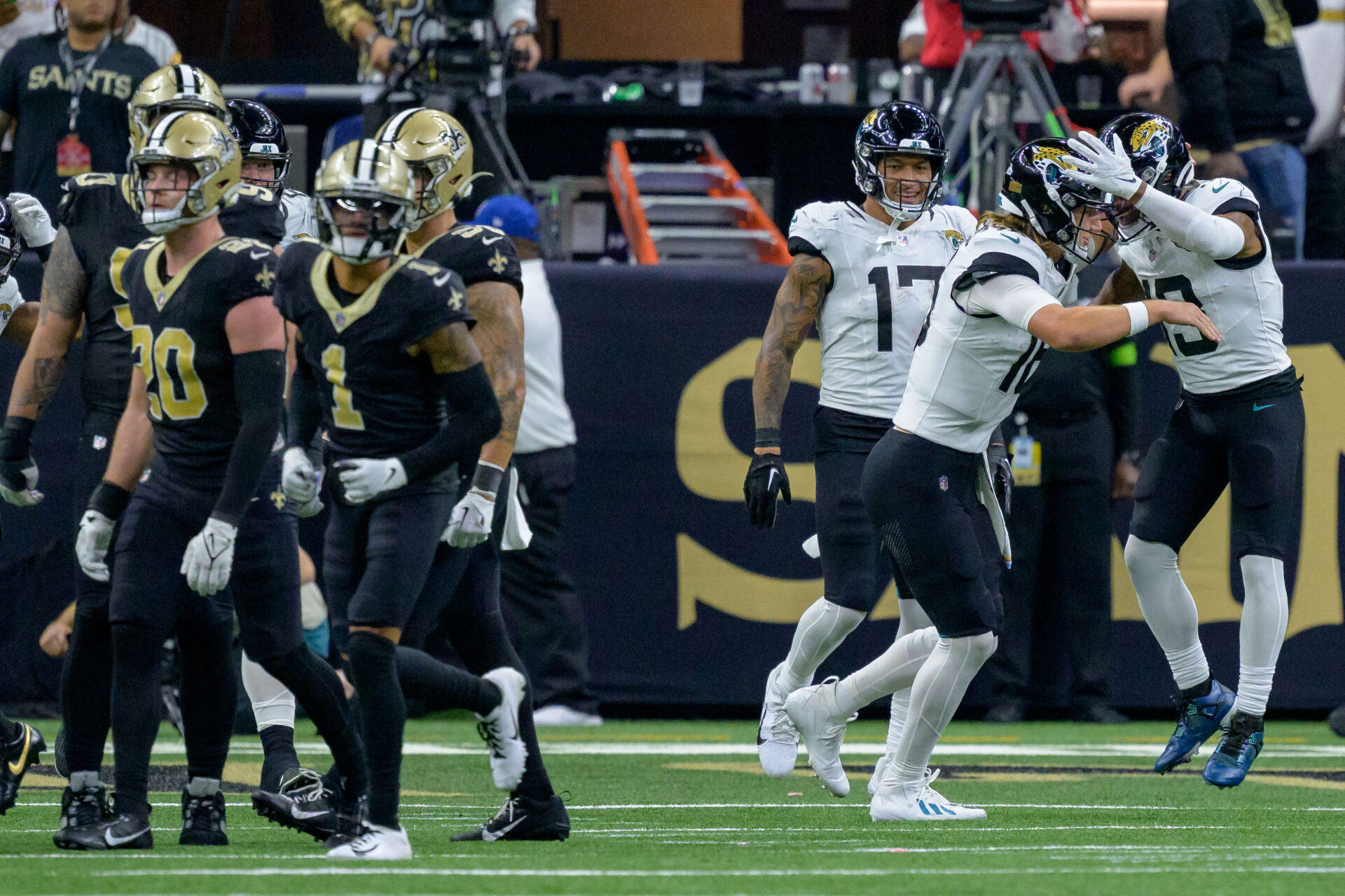 Trevor Lawrence and Christian Kirk celebrate the winning touchdown