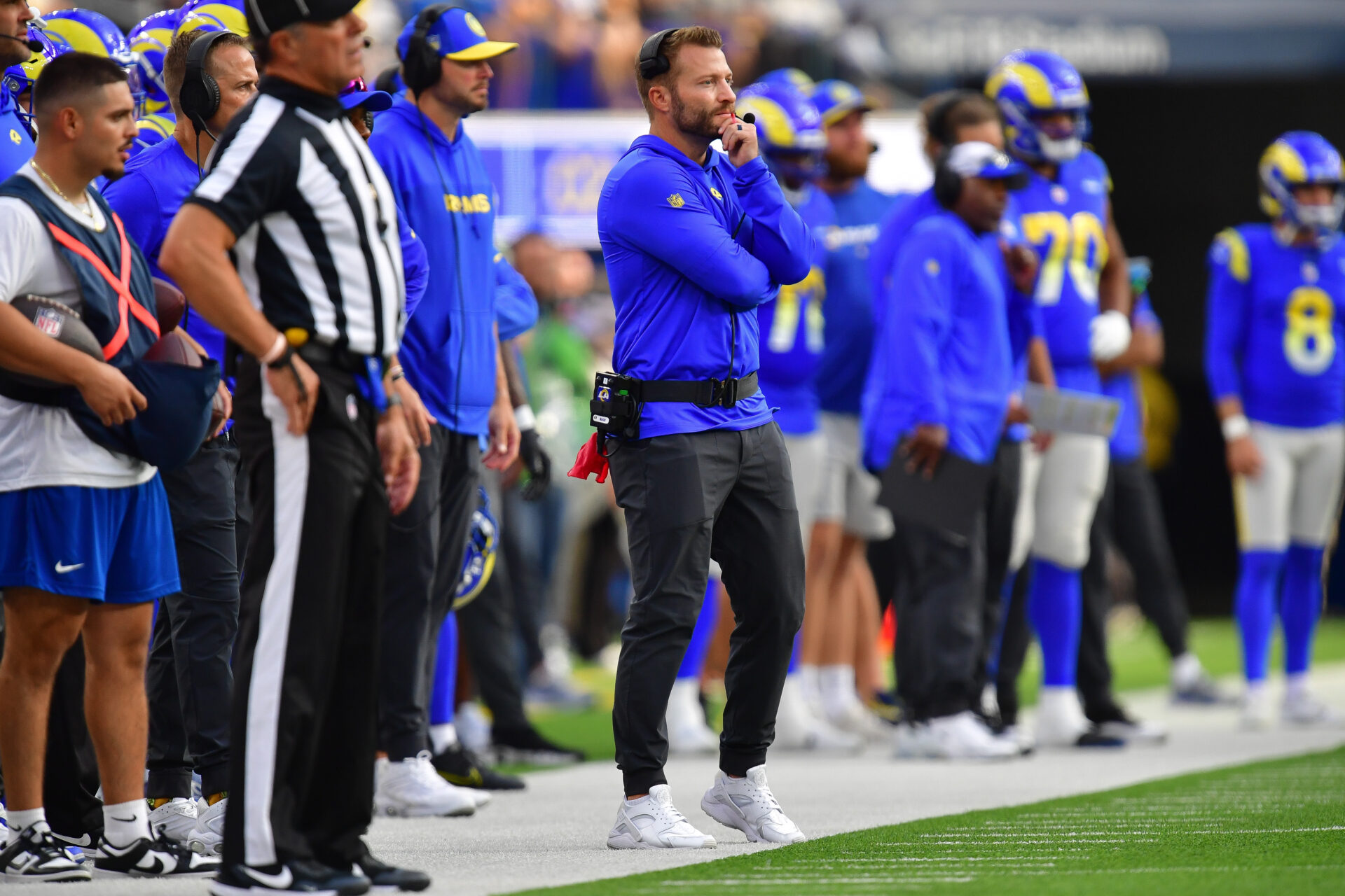 Sean McVay stands on the sideline with his hand on his chin