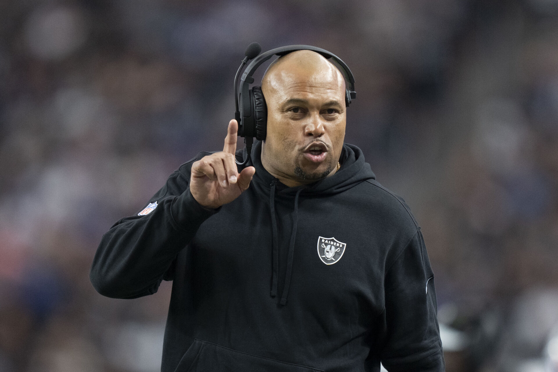 Antonio Pierce signals to his players. 