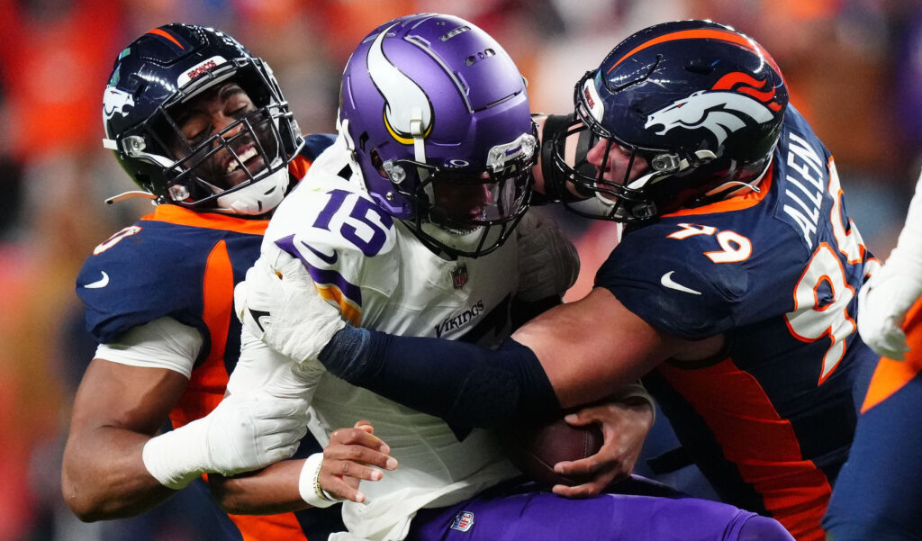 Jonathon Cooper and Zach Allen of the Denver Broncos sack Minnesota Vikings quarterback Josh Dobbs