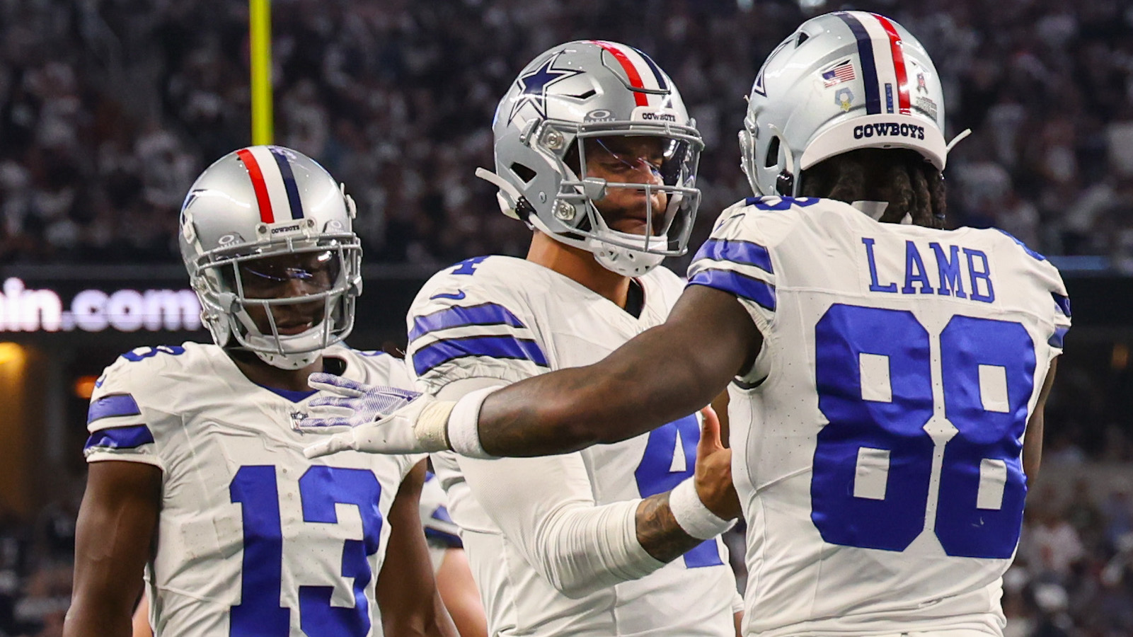 Dallas Cowboys QB Dak Prescott and WR CeeDee Lamb celebrate a touchdown