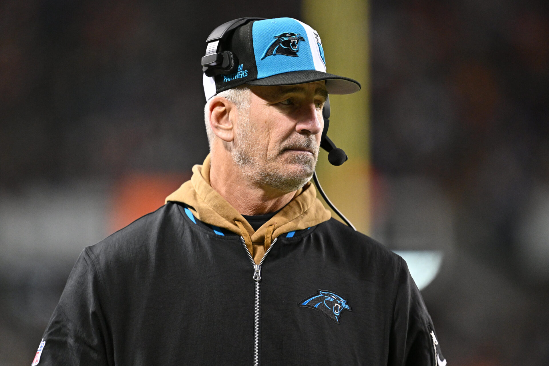 Frank Reich stands on Panthers sideline. 