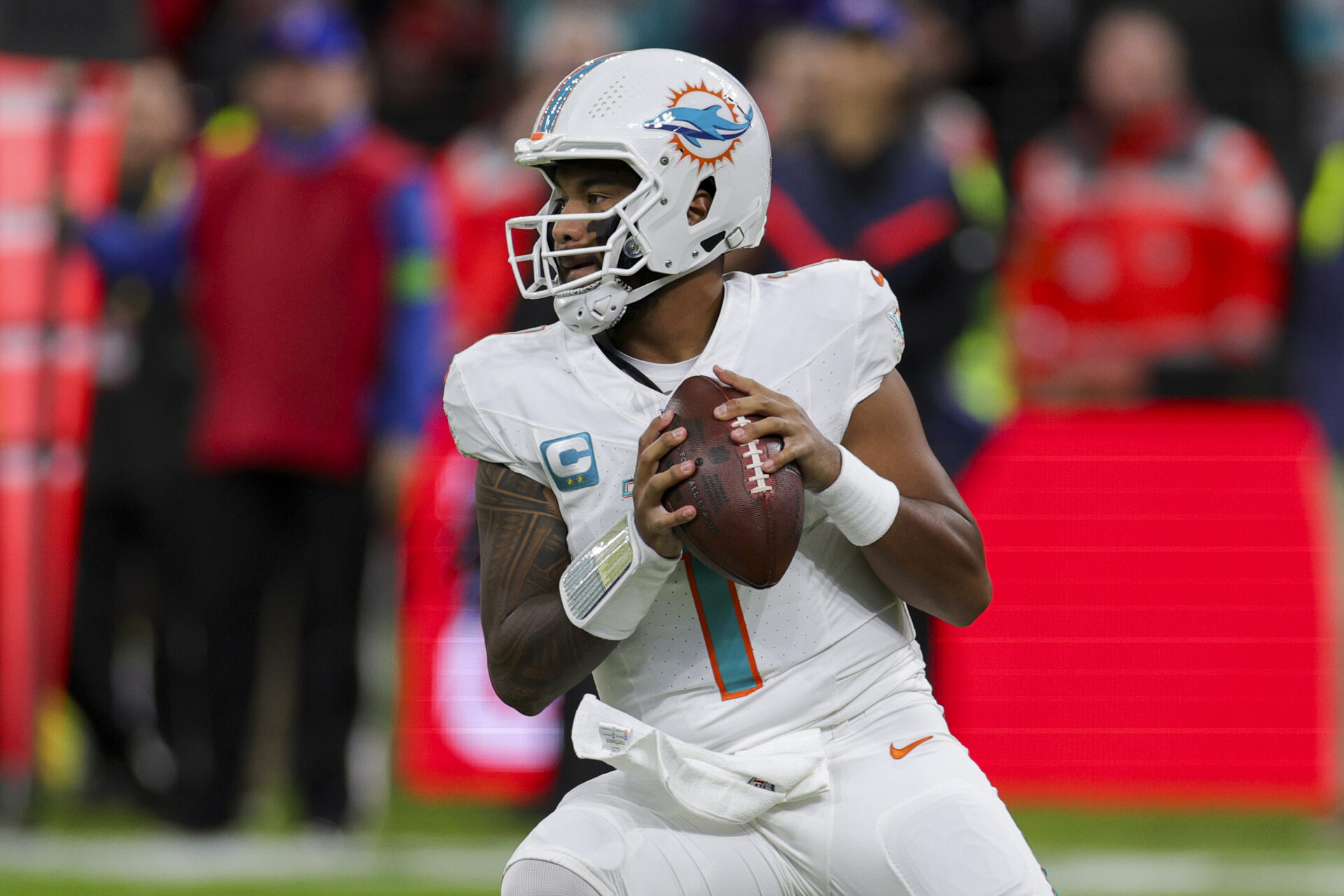 A close-up of Tua Tagovailoa as he looks to pass