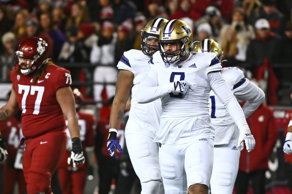 Washington Edge Bralen Trice celebrates a sack vs. Washington State