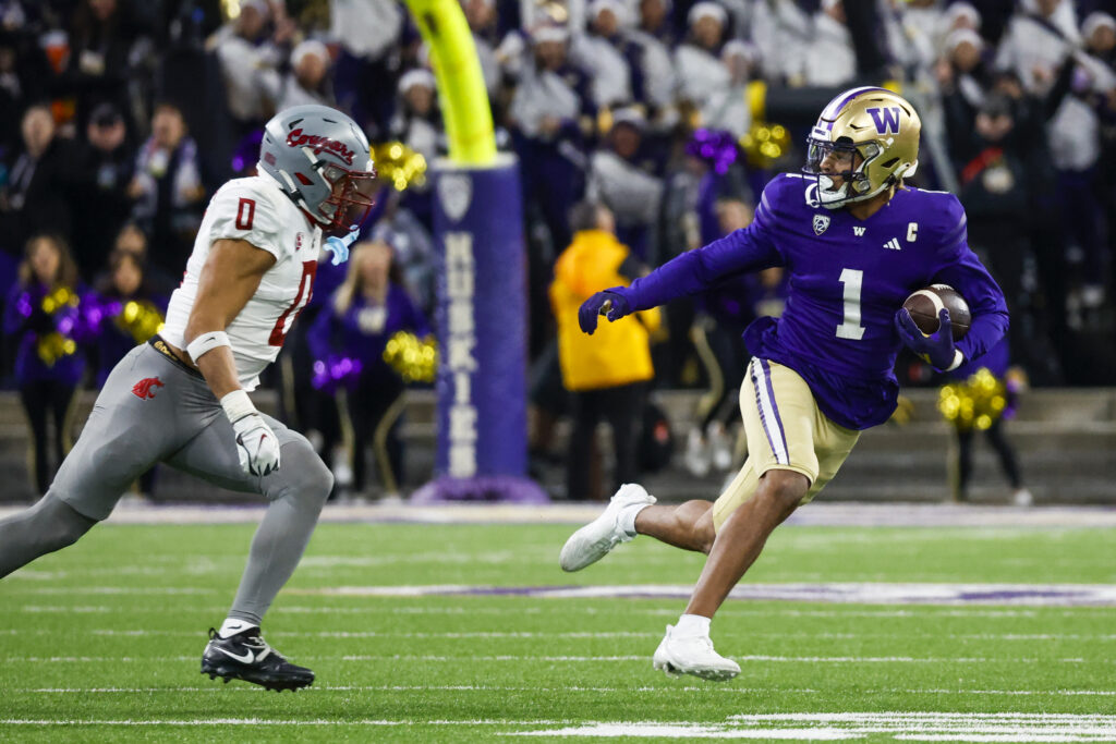 Washington WR Rome Odunze runs away from Washington State defender