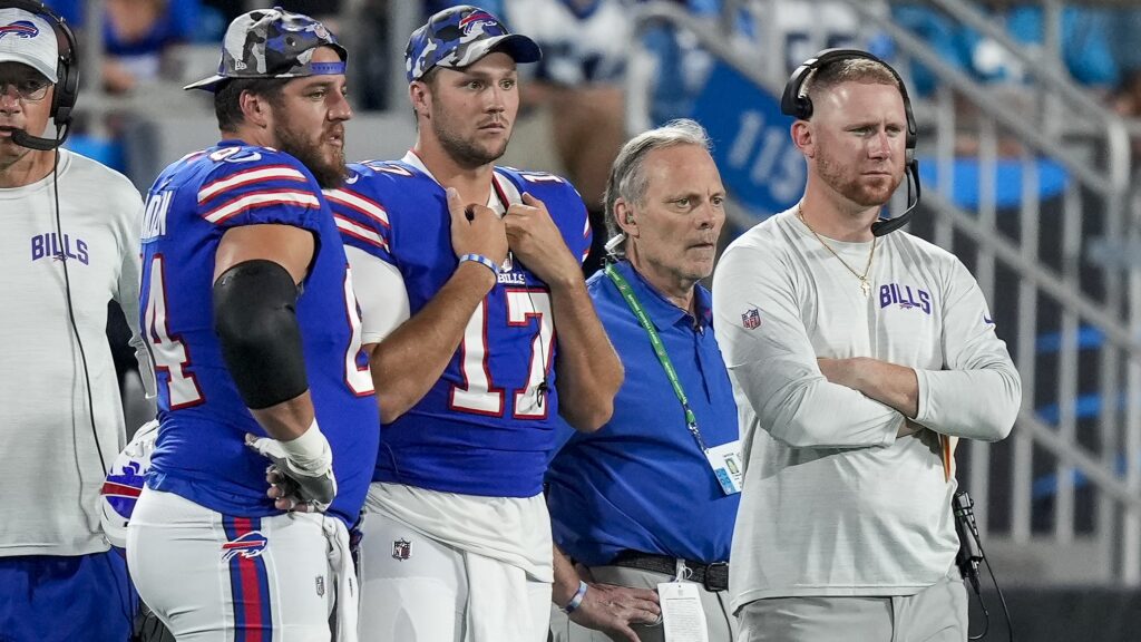 Joe Brady stands next to Buffalo Bills QB Josh Allen