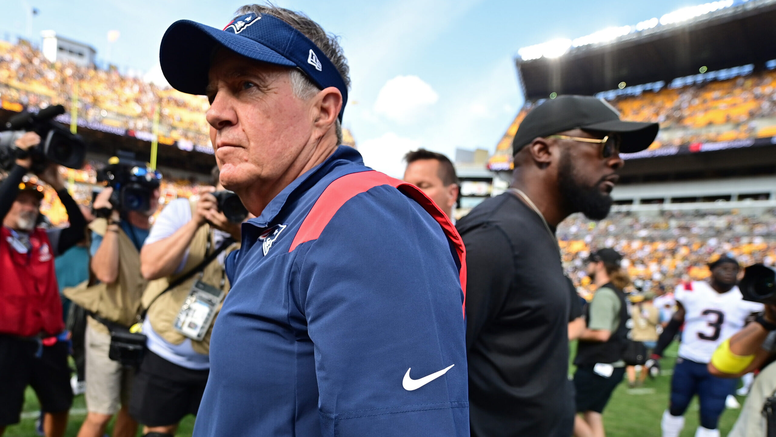 New England Patriots head coach Bill Belichick walks away from Pittsburgh Steelers head coach Mike Tomlin