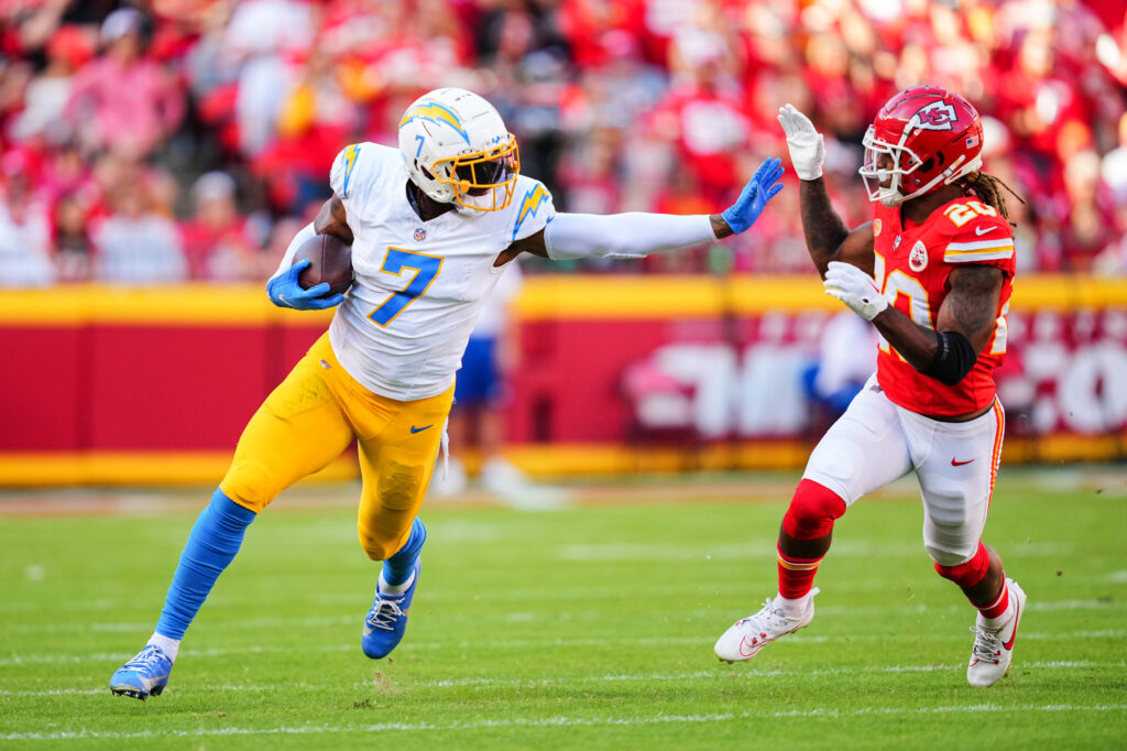 Gerald Everett stiff arms a Chiefs defender