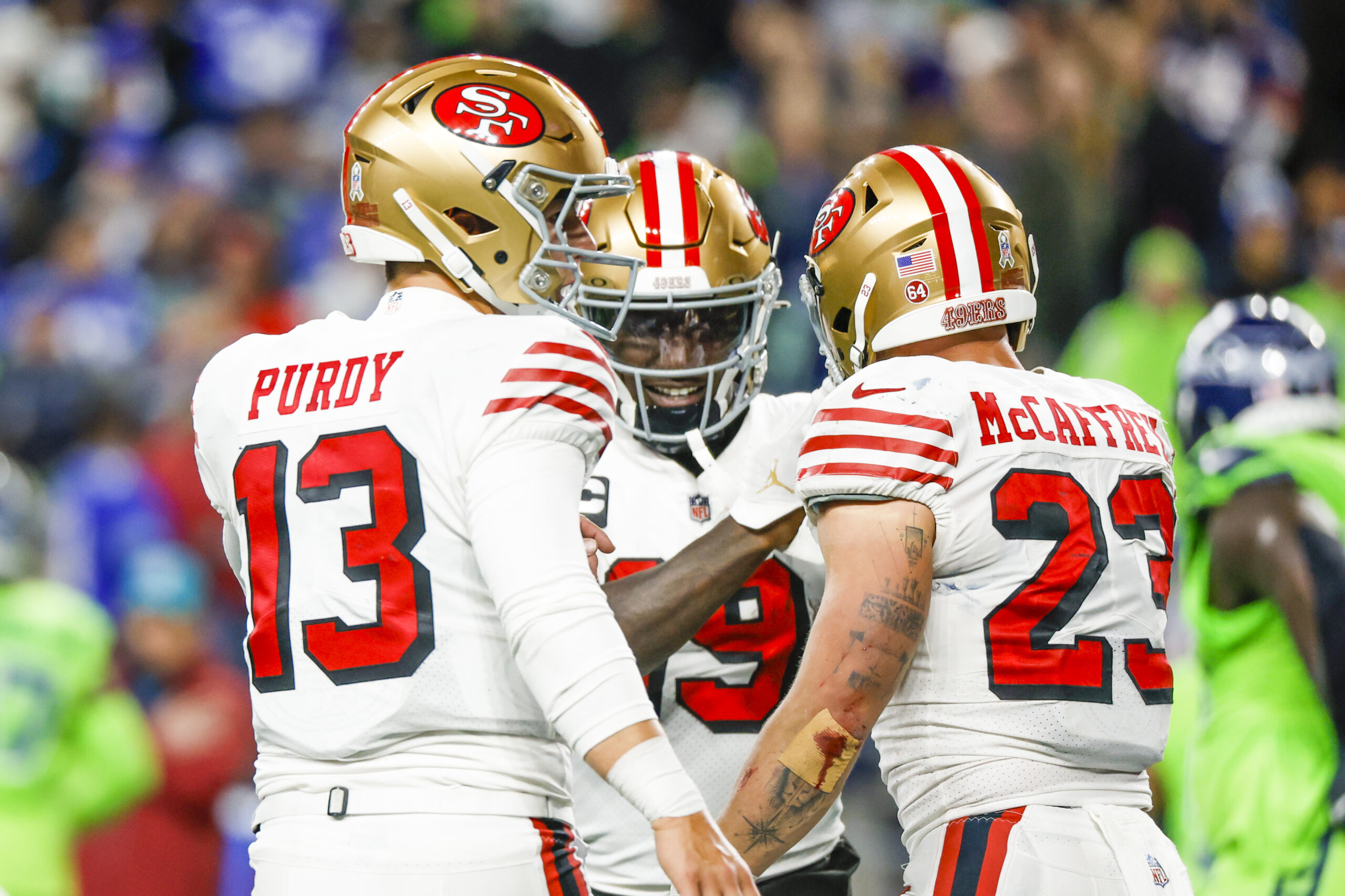 Purdy, McCaffrey and Samuel celebrate