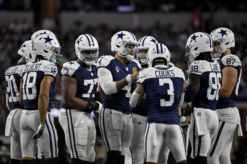 The Dallas Cowboys' offense huddles before a play