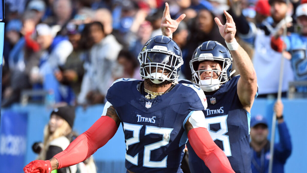 Tennessee Titans running back Derrick Henry (22) and quarterback Will Levis (8) celebrate a touchdown