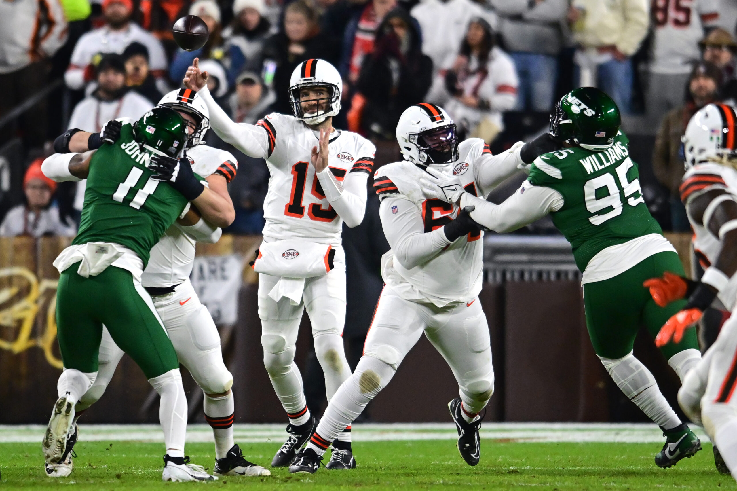 Joe Flacco passes behind a Browns offensive line that's getting pressured