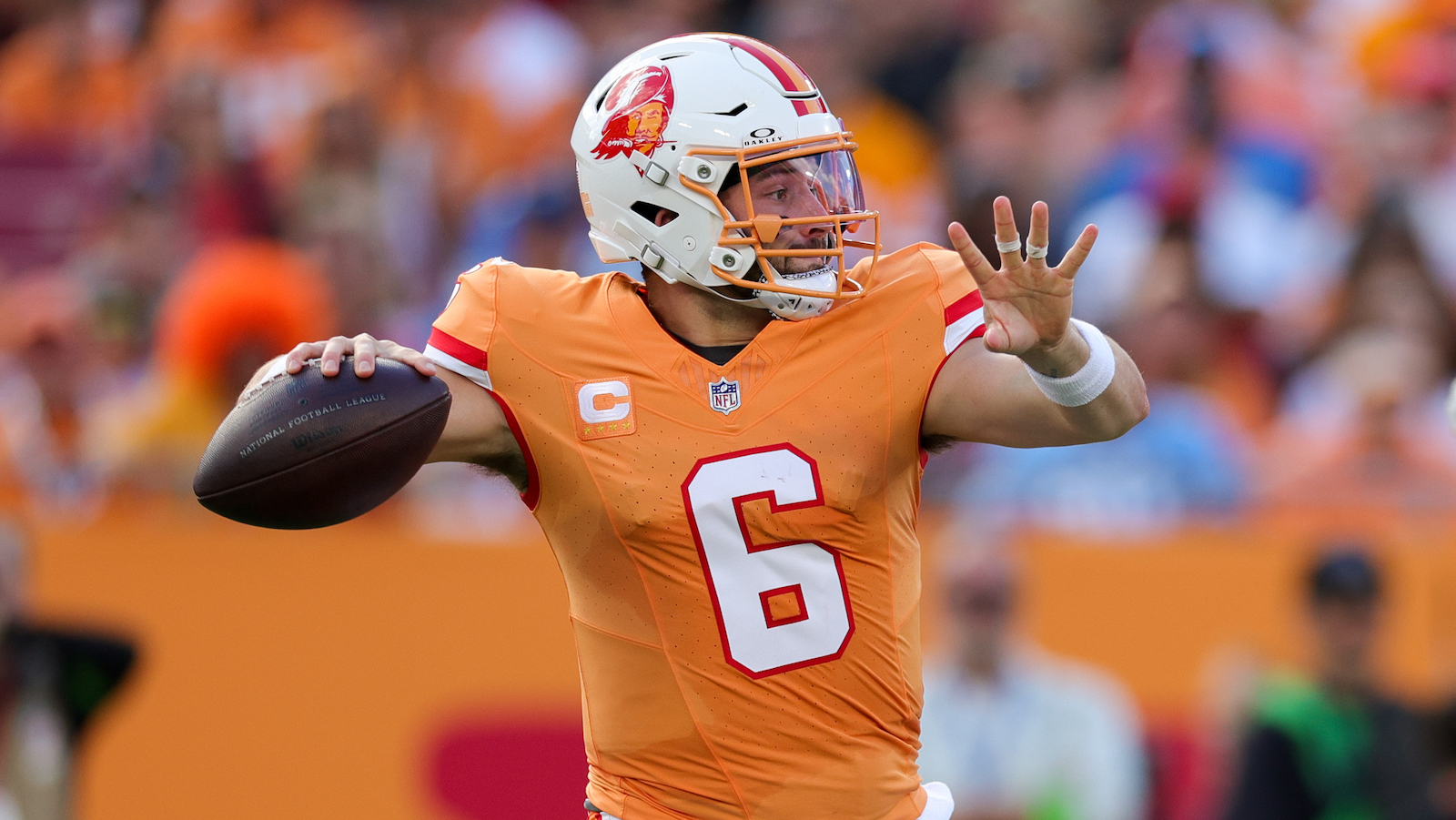 Tampa Bay Buccaneers quarterback Baker Mayfield prepares to throw a pass.