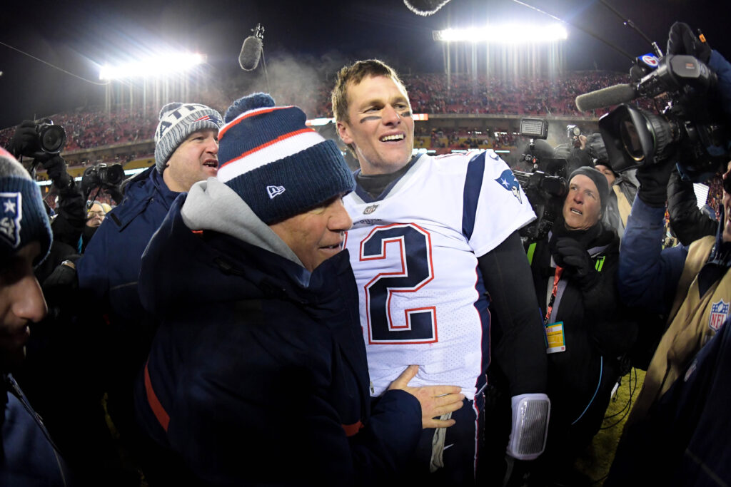 Tom Brady embraces Bill Belichick after game.