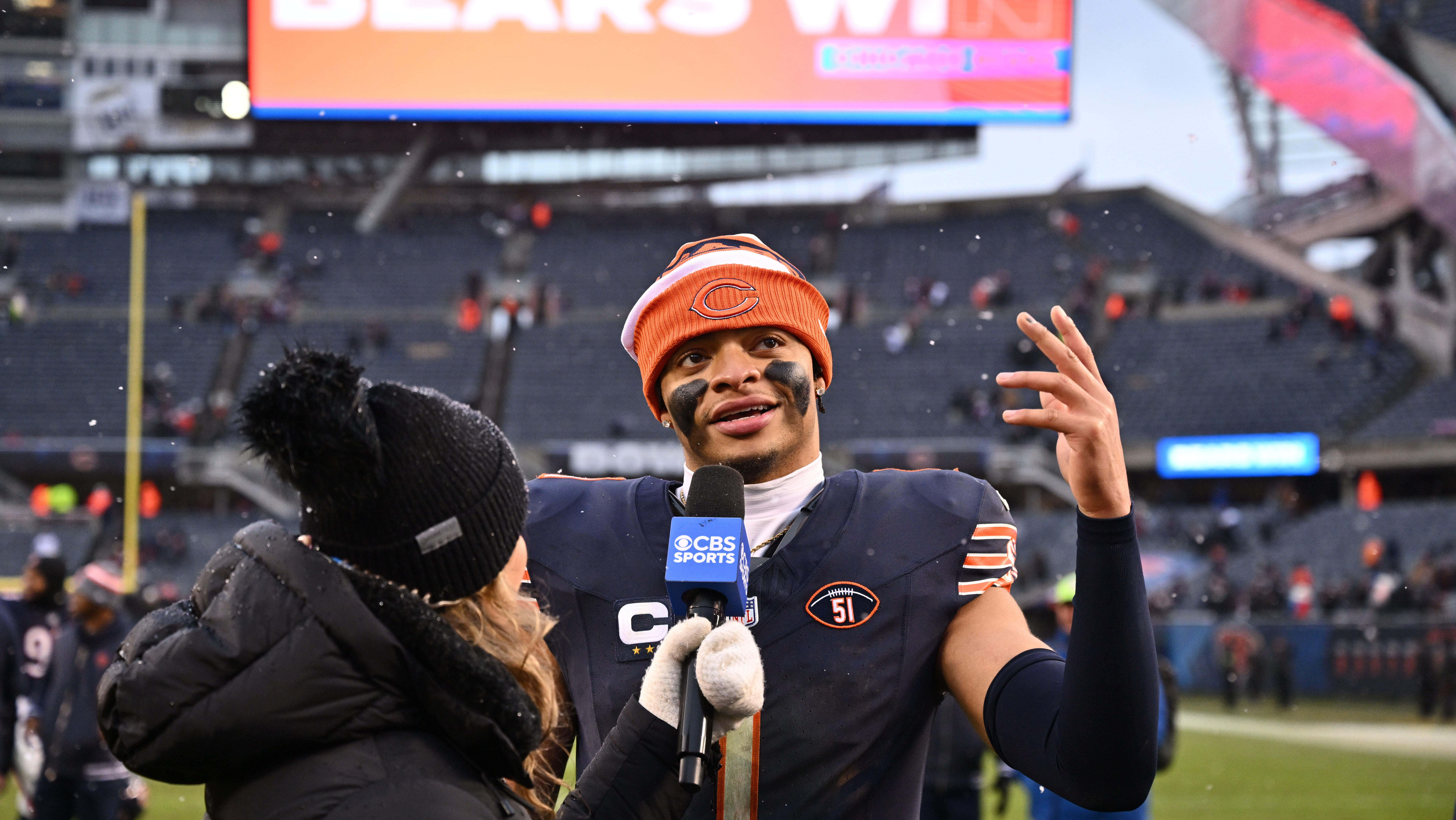 Justin Fields speaks with reporter after Bears win.