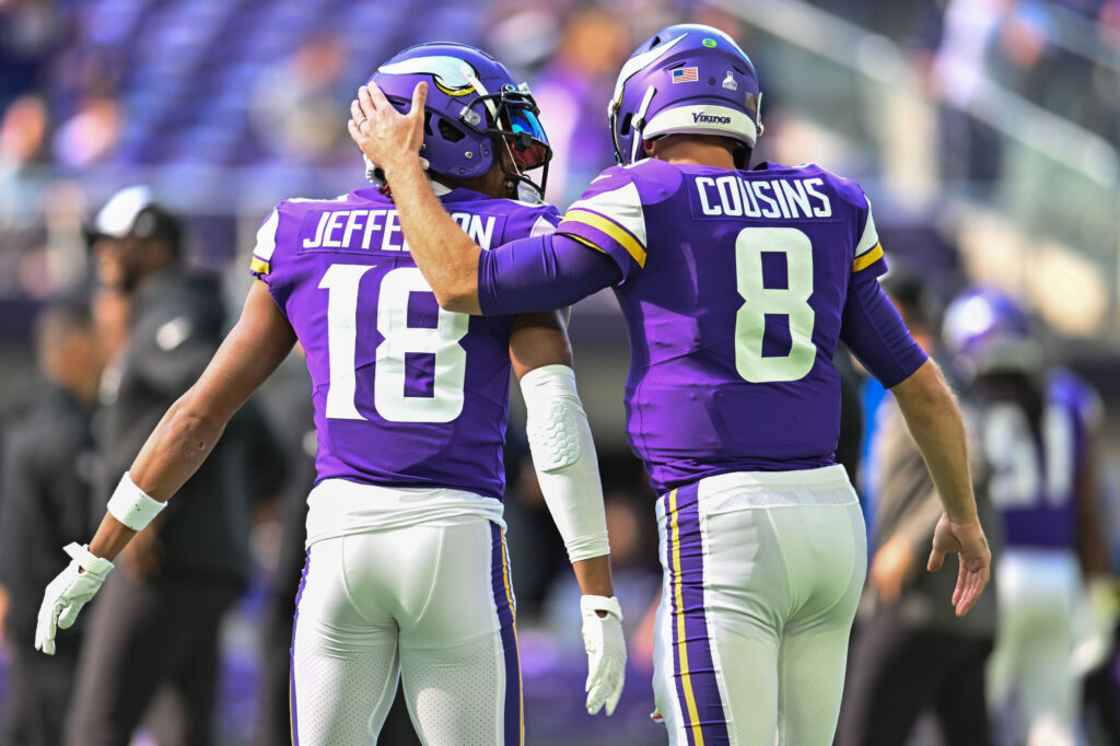 Kirk Cousins pats Minnesota Vikings wide receiver Justin Jefferson on the head. 