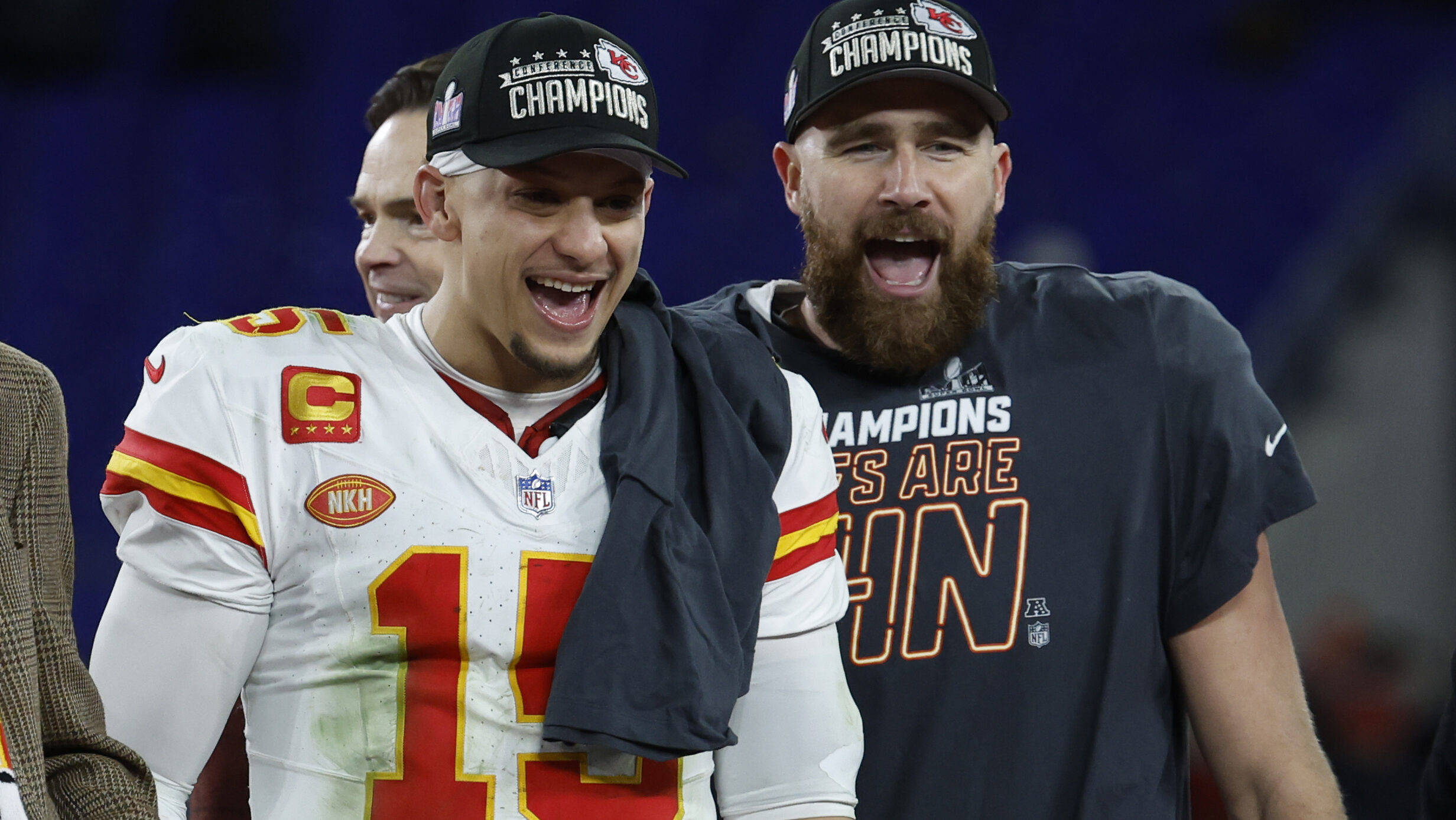 Patrick Mahomes celebrates with Travis Kelce following AFC Championship win.