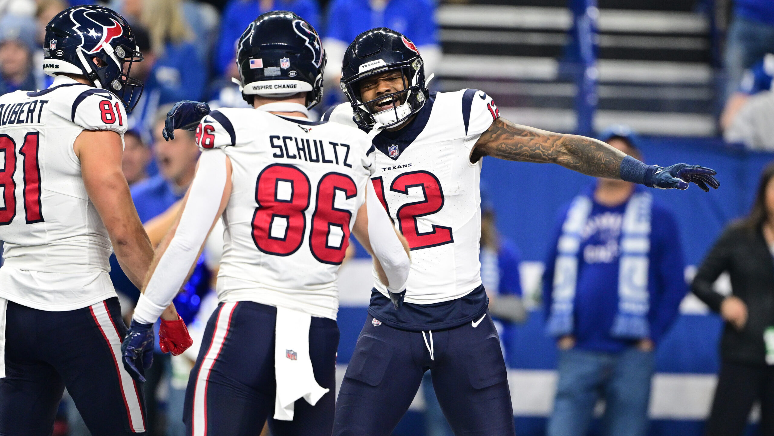 Nico Collins celebrates a Texans' touchdown with Dalton Schultz