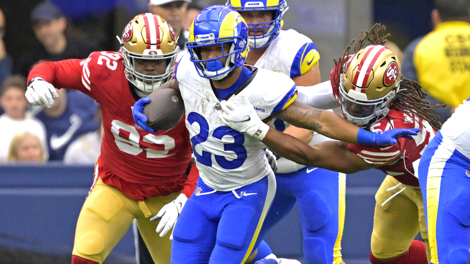 49ers linebacker Fred Warner tackles Rams running back Kyren Williams