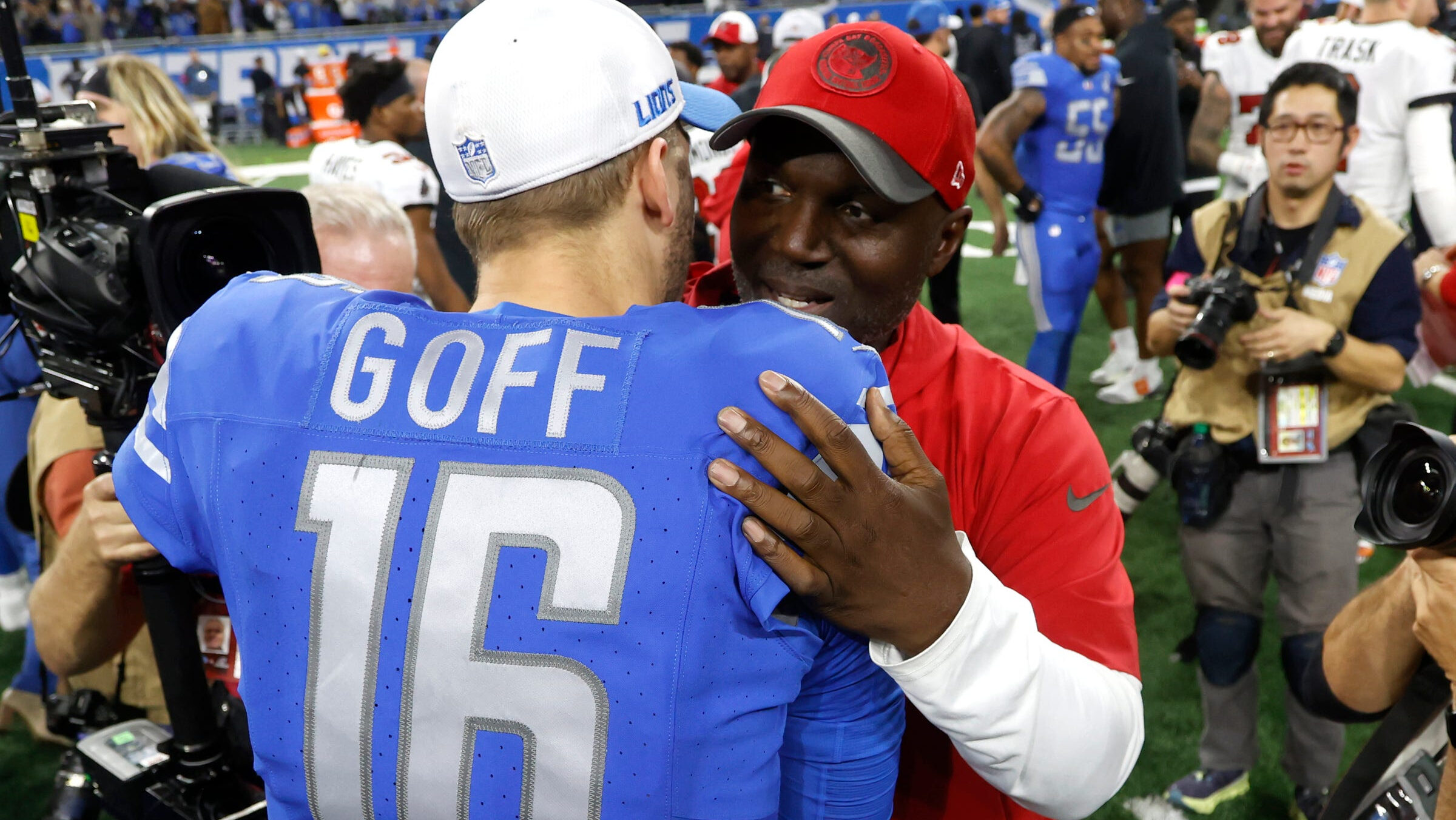 Todd Bowles hugs Jared Goff following divisional round game