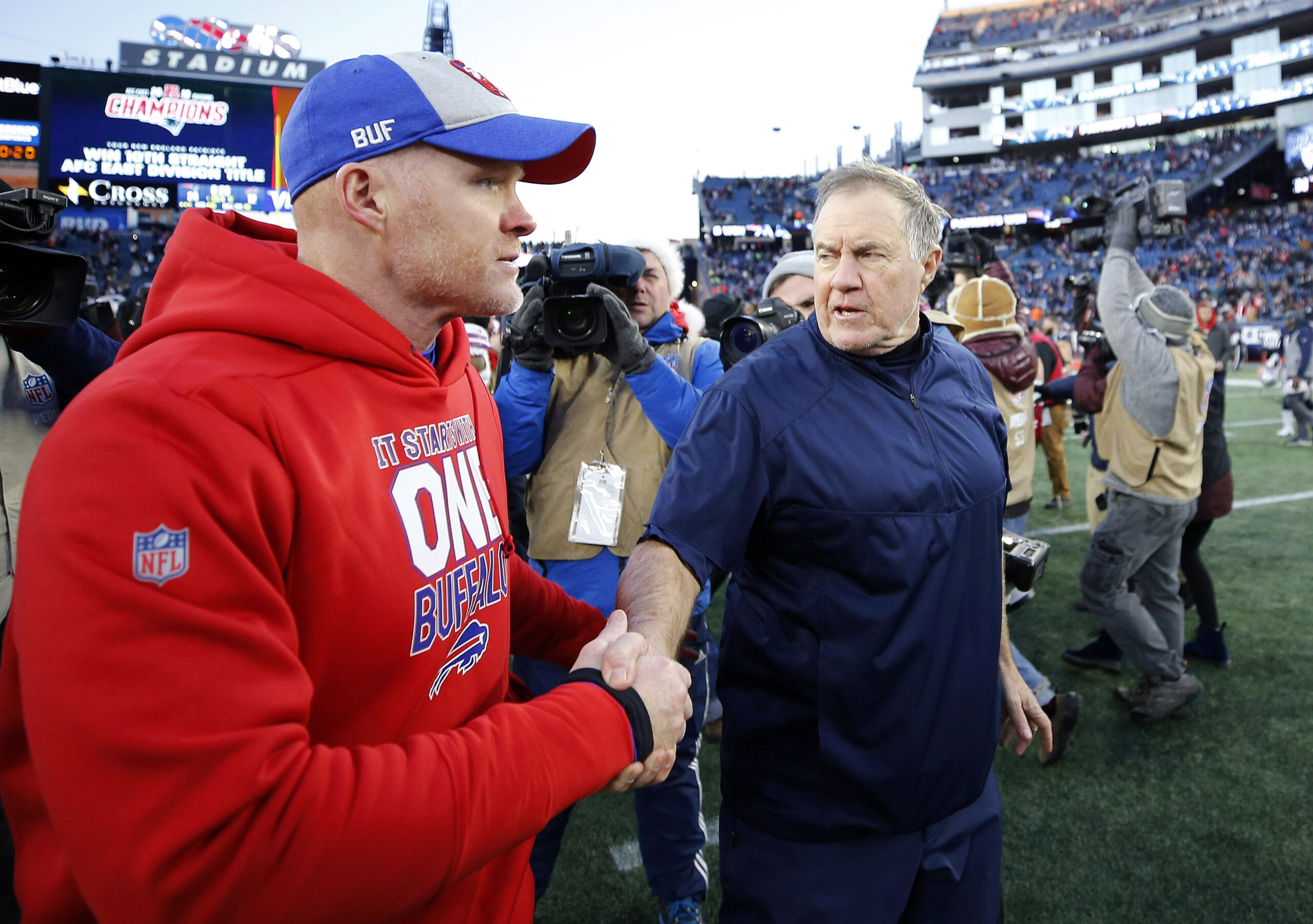 Bill Belichick and Sean McDermott shake hands after the game