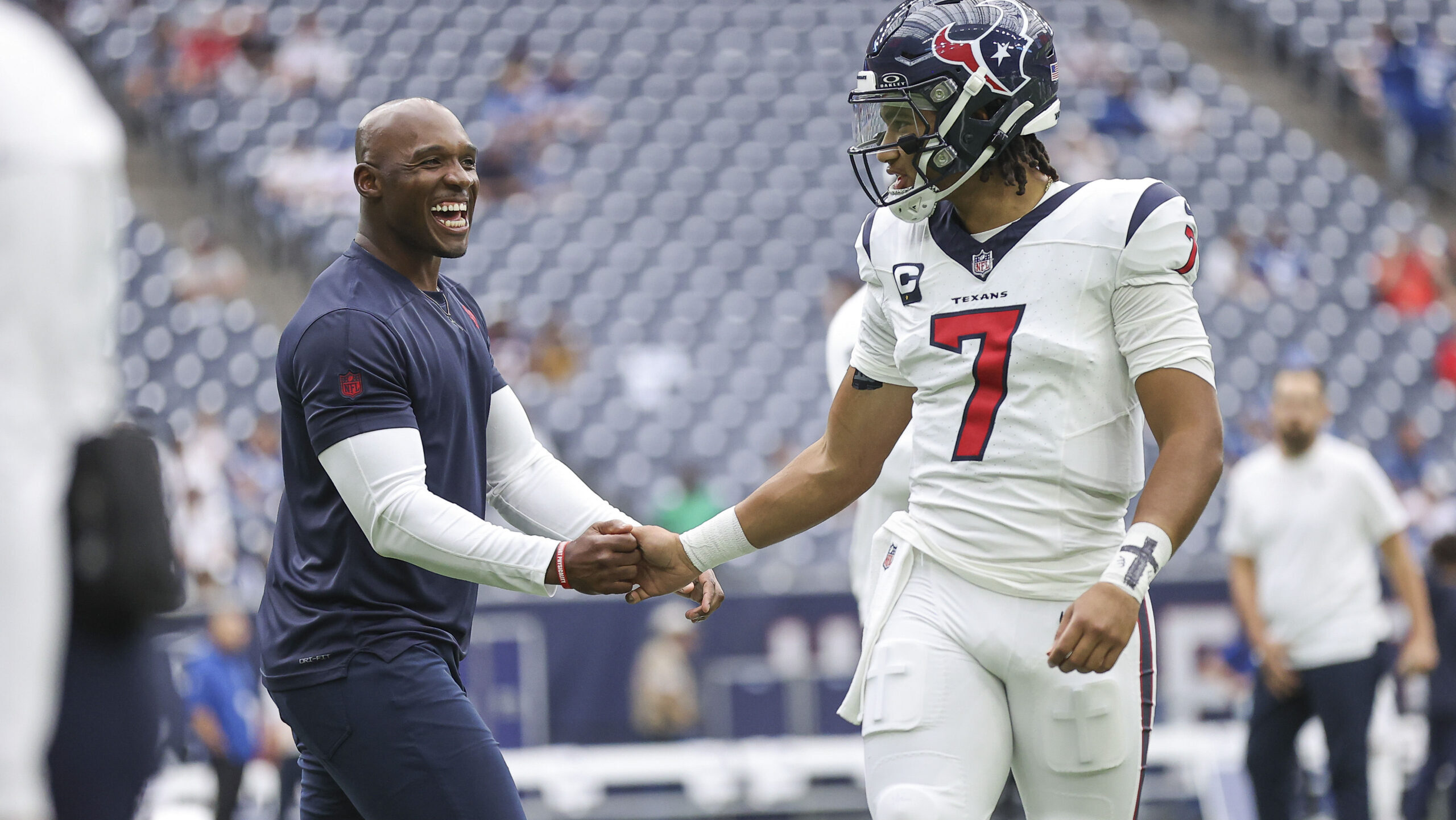 Houston Texans head coach DeMeco Ryans shakes hands with quarterback C.J. Stroud