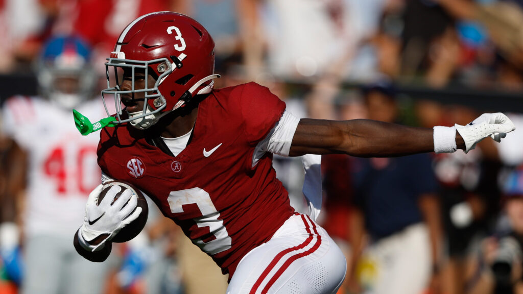 ALabama cornerback Terrion Arnold runs with the football