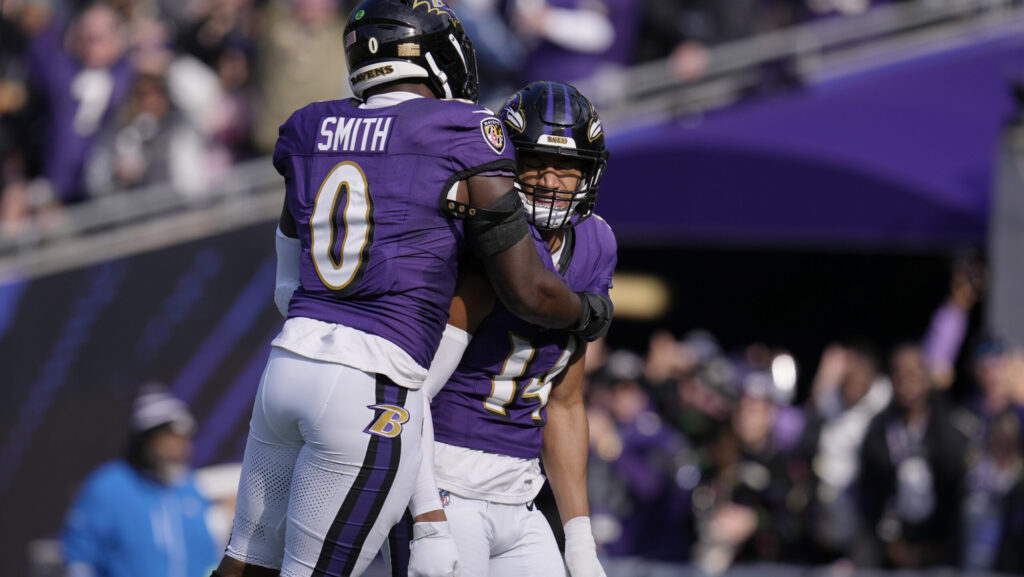 Baltimore Ravens safety Kyle Hamilton (14) celebrates with linebacker Roquan Smith (0)