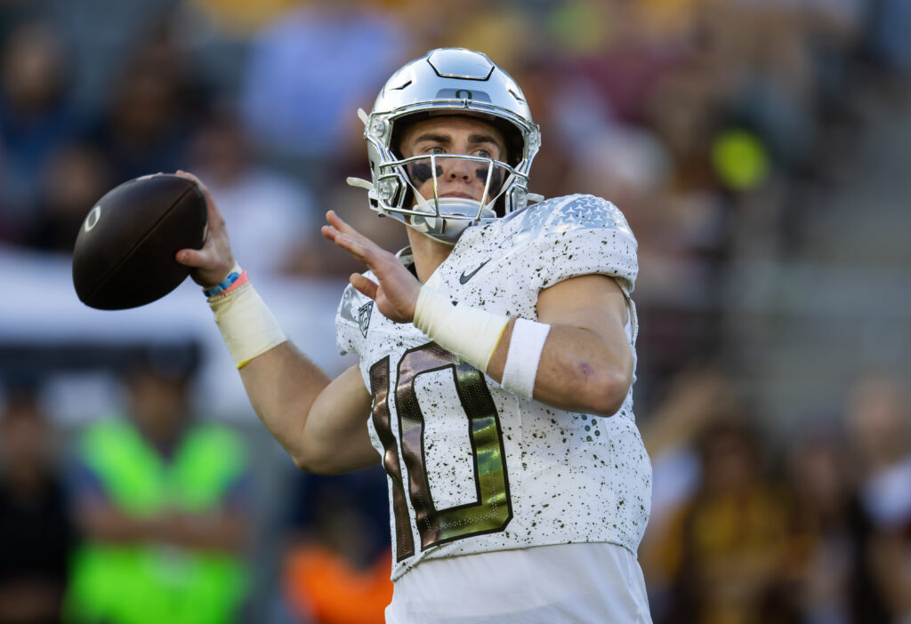 Bo Nix throws the football