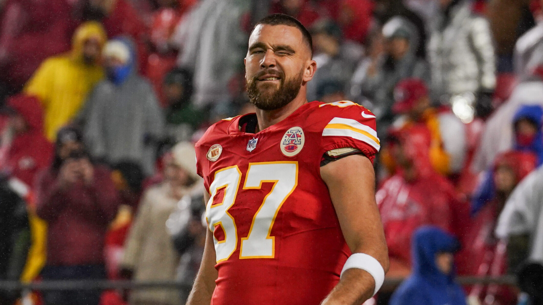 Kansas City Chiefs' tight end Travis Kelce winks at the camera.