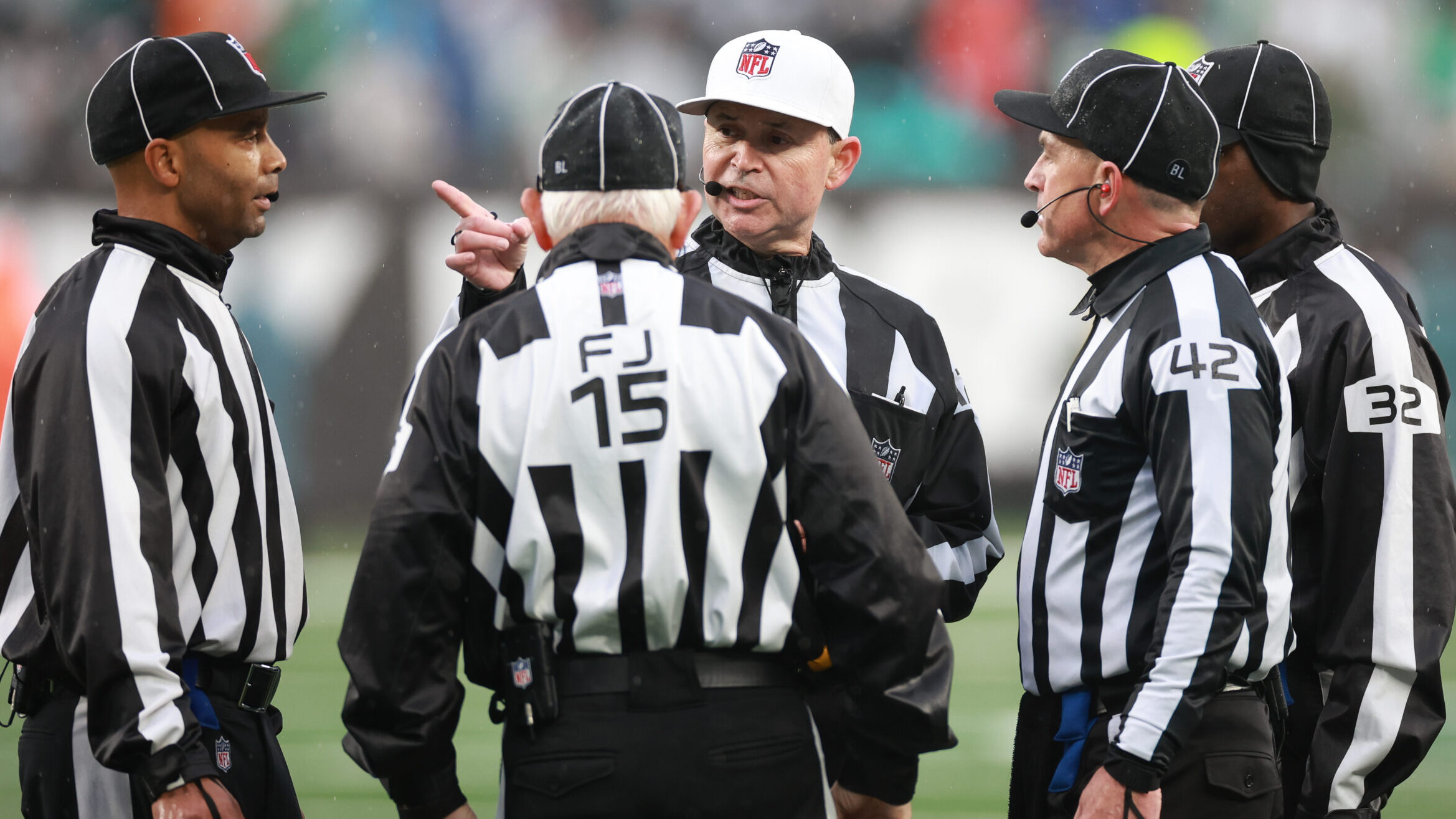 NFL officials in a huddle