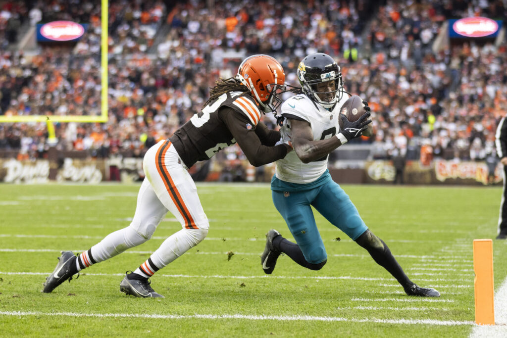 Calvin Ridley close to the end zone with a Browns defender pushing him out of bounds