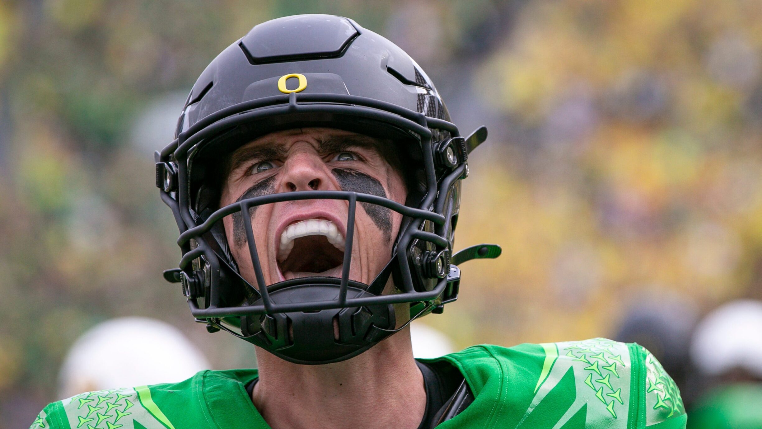 Oregon QB Bo Nix yells in excitement.