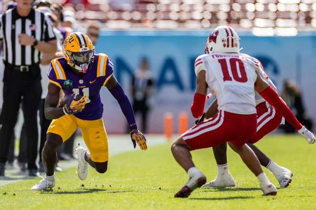 Brian Thomas Jr. runs after a catch