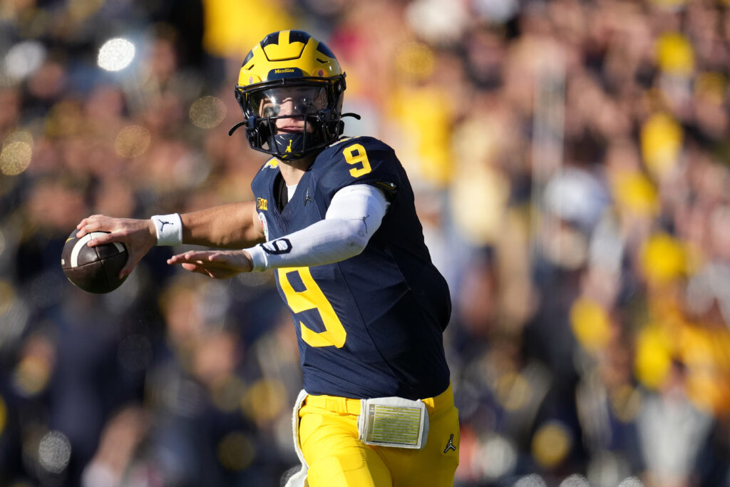 J.J. McCarthy throws the ball