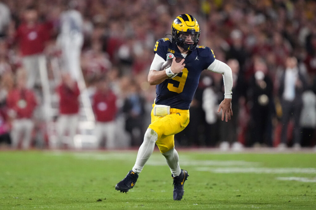 J.J. McCarthy runs with the ball