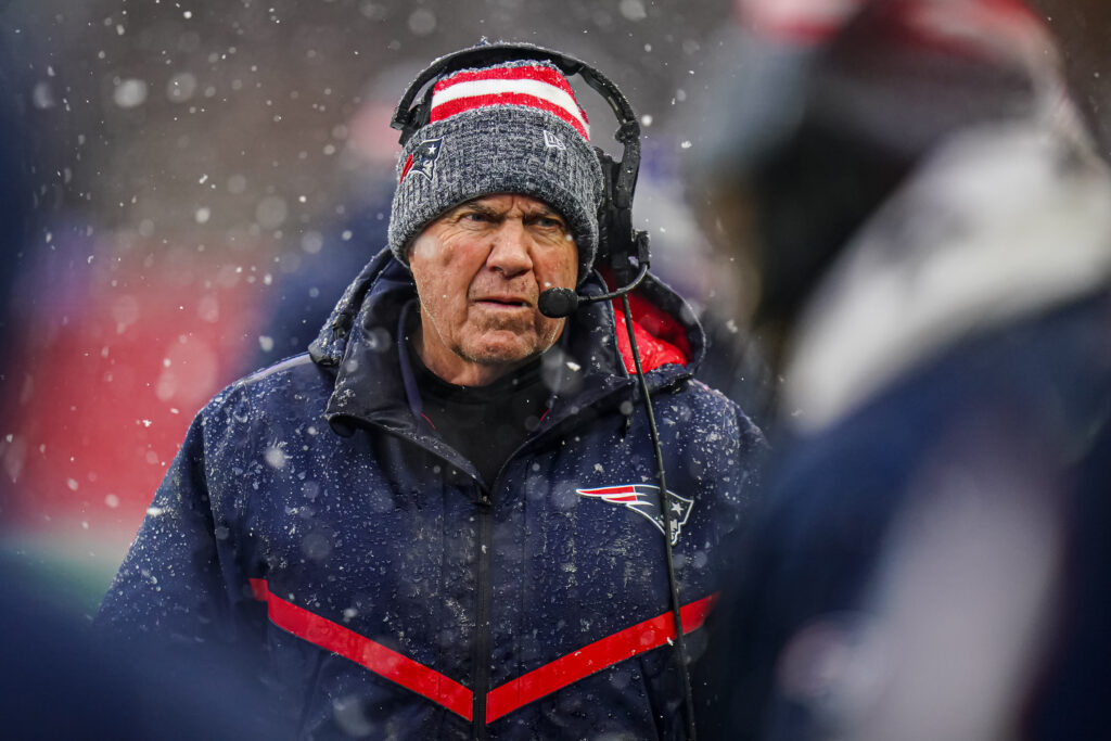 A close-up image of a snowy Bill Belichick