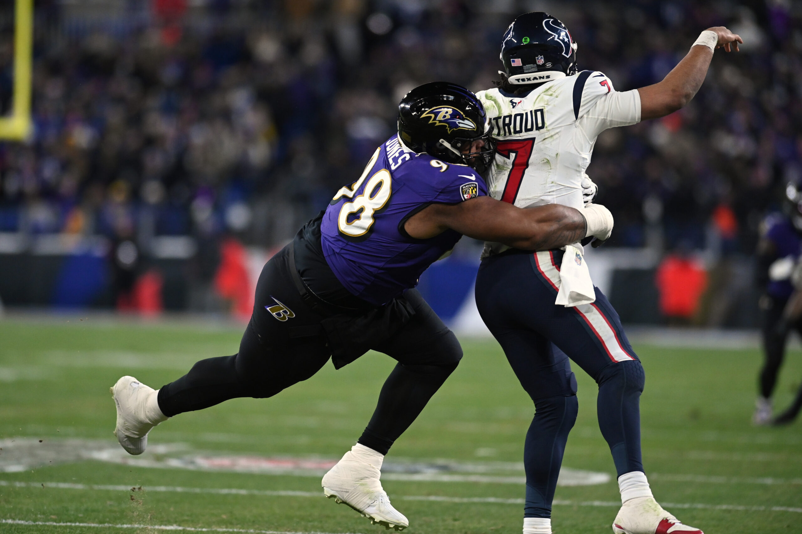 Ravens' DT Travis Jones wraps up Texans' QB C.J. Stroud as he throws the ball