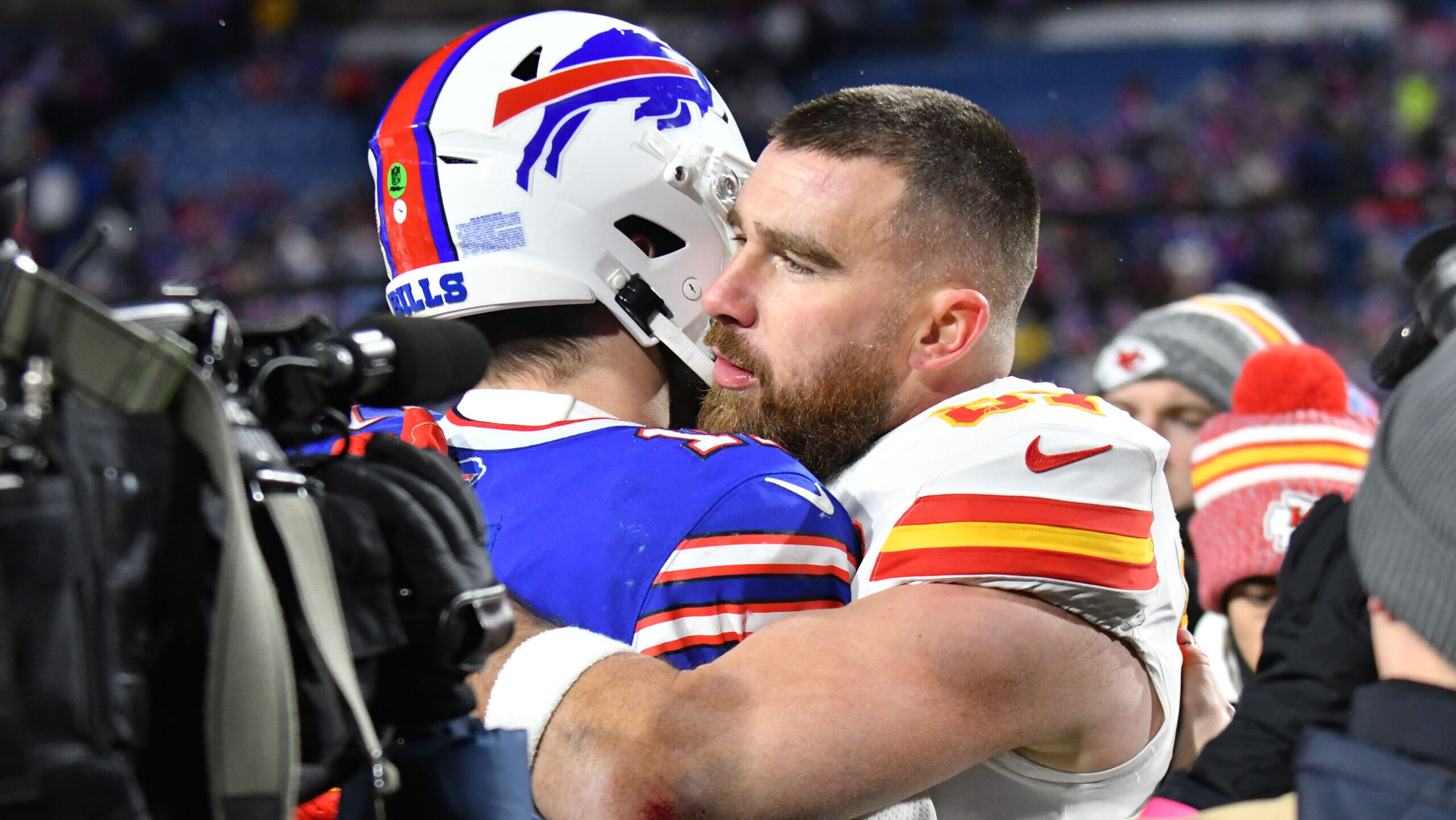 Kansas City Chiefs Tight End hugging Buffalo Bills quarterback Josh Allen